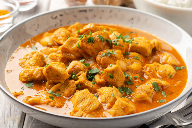 istock Chicken curry in plate on wooden background 1320778202