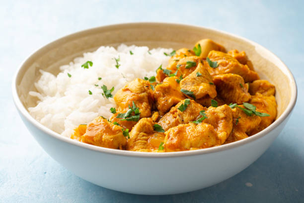istock Chicken curry with rice in bowl on concrete background 1320778220