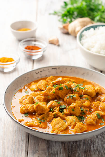 istock Chicken curry in plate on wooden background 1320778224