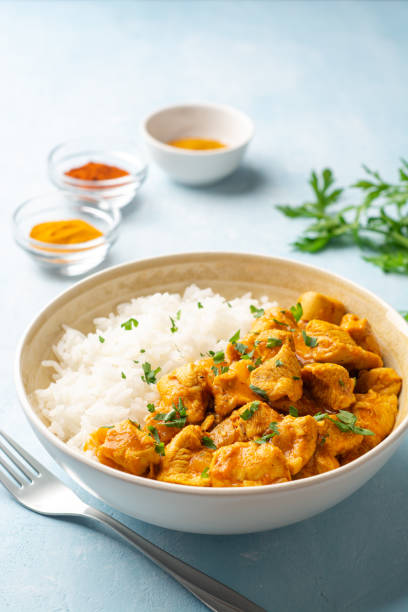 istock Chicken curry with rice in bowl on concrete background 1320778230