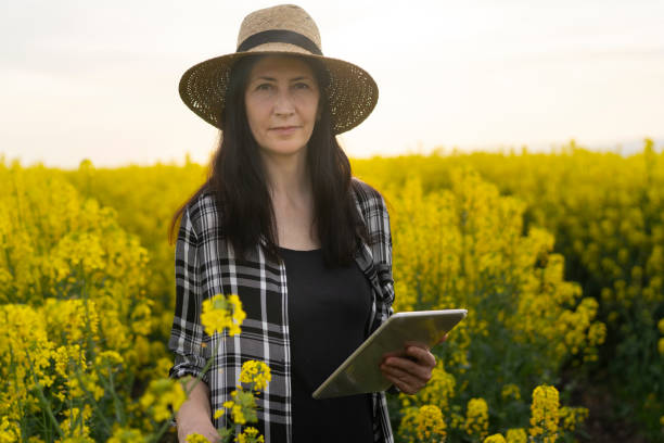 istock Woman farmer holding an tablet checking her crop 1320778874
