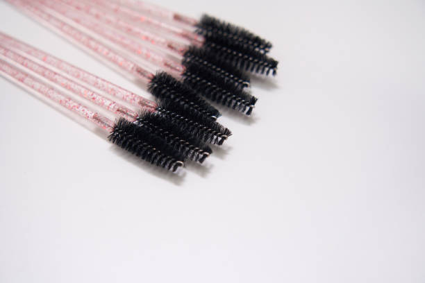 eyelash brushes on white background with copyspace eyelash brushes on a white background with copyspace lash and brow comb stock pictures, royalty-free photos & images