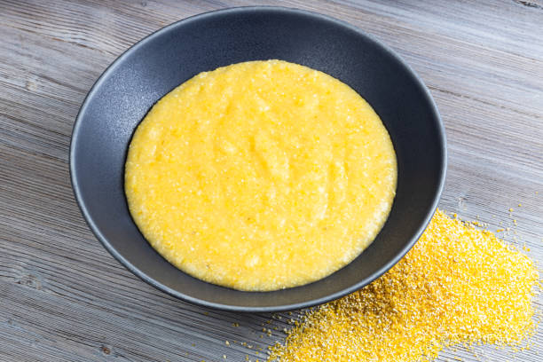 istock cooked maize porridge and handful of cornmeal 1320779279