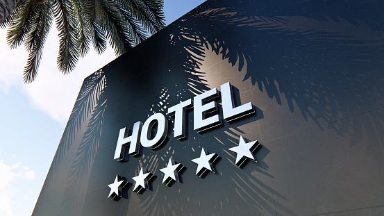 Sanremo, Italy - May 10, 2022: Front facade of the Casino in Sanremo, Italy, with national, European and regional flags.