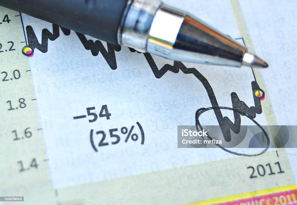 Analyzing the business graph Analyzing the business graph and pointing Aiming Stock Photo