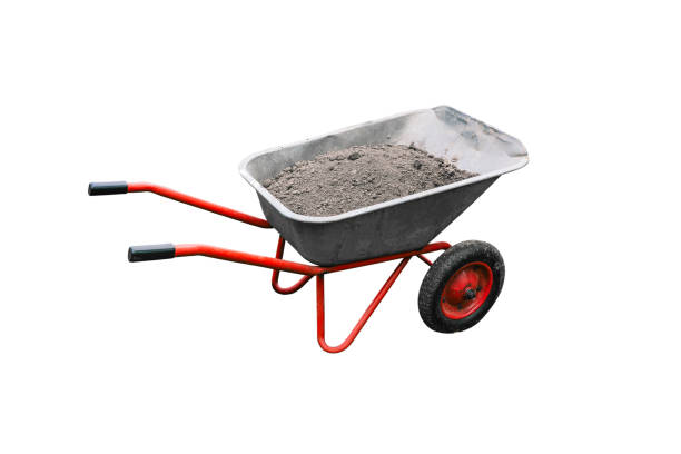 istock Construction cart with earth isolated on white background. Metal trolley with wheels. A tool for working in a garden or construction site. Gardening or house building concept 1320780500