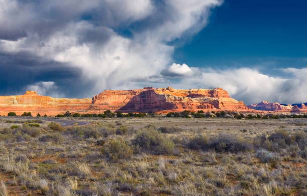 istock Red rocks on a plateau under a cloudy sky. 1320781363
