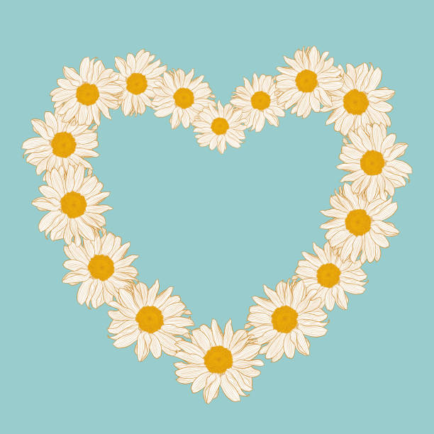 istock Floral wreath from daisies in the shape of heart on blue background 1320782155