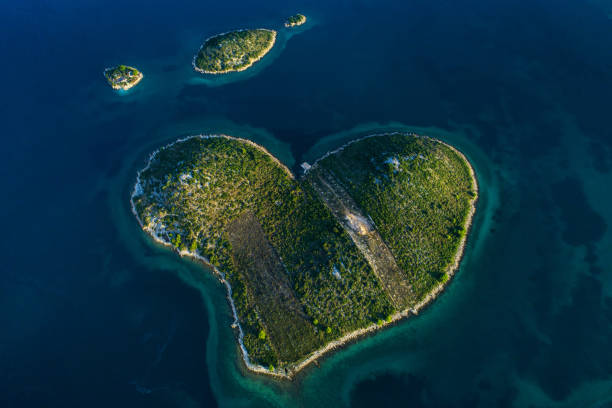 Heart shaped love island Galesnjak in Croatia Zadar archipelago aerial view Aerial view of beautiful small heart shaped island, Island of Love, Pasman channel, Zadar, Dalmatia, Croatia croatian culture photos stock pictures, royalty-free photos & images
