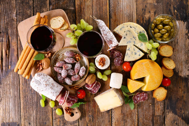 istock wine glasses composition with sausage, cheese and grapes 1320782348