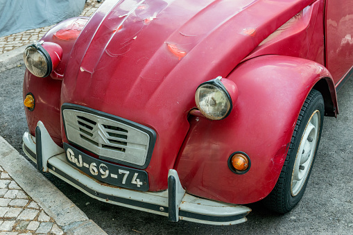 Siracusa, Ortigia, Italy: vintage, red Fiat 500 shown parked on a street in historic Ortigia, Sicily. The cinquecento is a city car produced by the Italian manufacturer Fiat between 1957 and 1975.