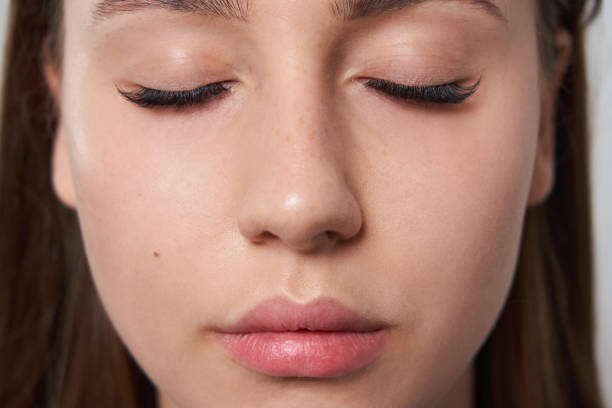 istock Beautiful girl with extended eyelashes and eyes closed 1320784779