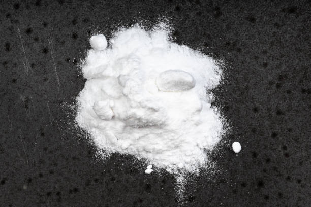 istock pile of sodium bicarbonate close up on black 1320786580