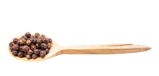 istock red kampot pepper in wooden spoon isolated 1320786990