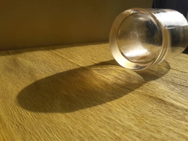 istock photo of light texture reflected from glass on yellow background 1320786997