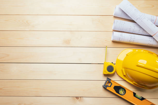 istock Work safety. Standard Construction site protective equipment on  top view wooden background, flat lay, copy space,safety first concepts. 1320788044