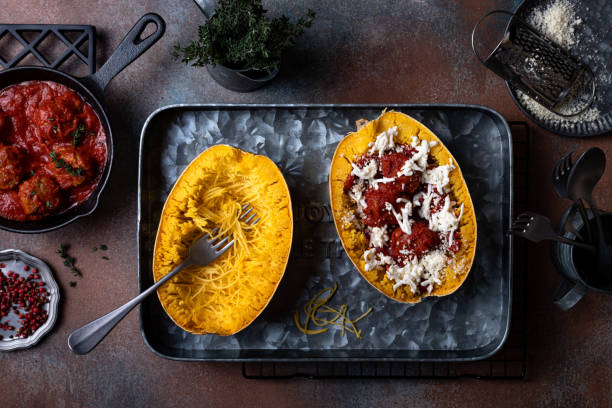 istock Cooking stuffed Spaghetti squash with meatballs in tomato sauce 1320790069