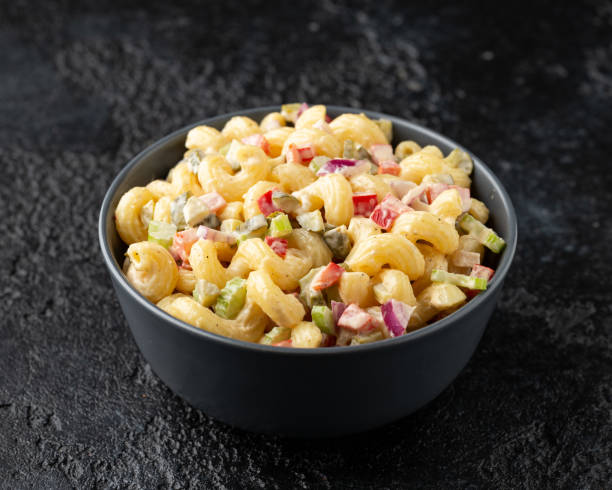 istock Macaroni Salad with red bell pepper, onion, celery, gherkins and mayonnaise dressing 1320791032