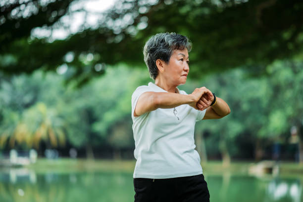 istock Asian chinese active senior woman exercise in a park 1320791722