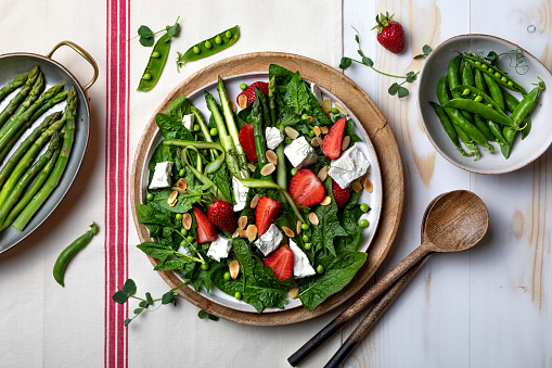 Green asparagus, strawberry, spinach, green sugar snap pea, almond and feta cheese salad