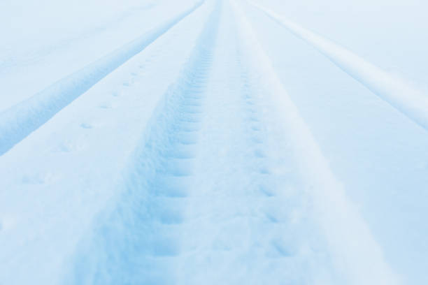 istock snow track imprint of snowmobile 1320793408