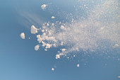 snow splash in the air, blue sky background