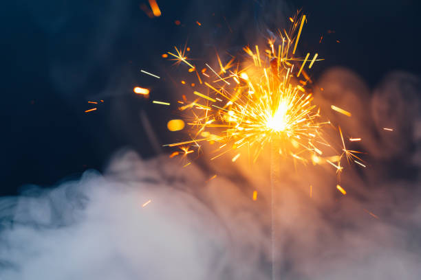 fire sparkler in dense smoke, abstract Christmas firework background