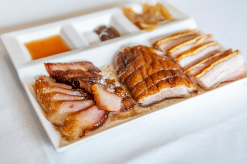 Roasted Sliced Duck breast fiilet steak. White background. Top view.