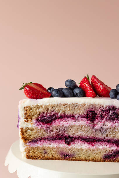 istock half blueberry cake decorated fresh berries 1320795904