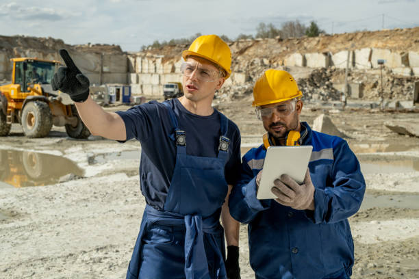 istock One of two builders pointing at unfinished construction 1320797832