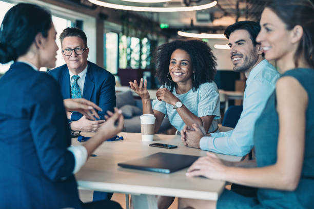 istock Business persons talking in the office 1320799248
