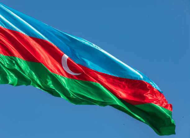 istock Azerbaijan flag waving against the blue sky 1320799309