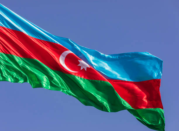 istock Azerbaijan flag waving against the blue sky 1320799345