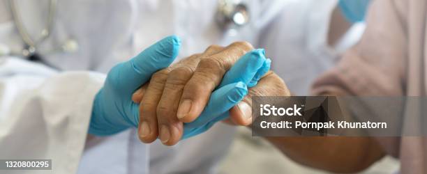 Parkinson And Alzheimer Female Senior Elderly Patient With Physician Doctor In Hospice Care Stock Photo - Download Image Now