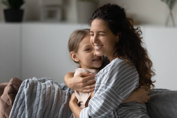 istock Loving Hispanic mom hug small biracial daughter 1320801526
