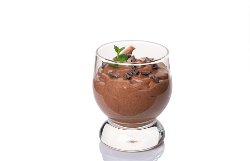 Vegan chocolate mousse with mint glass isolated on white background. . High quality photo