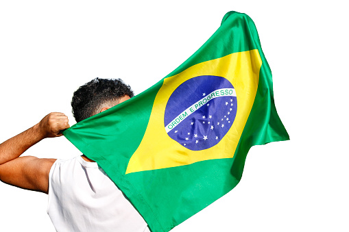 Man holding Brazil flag isolated on white background. Space for text.