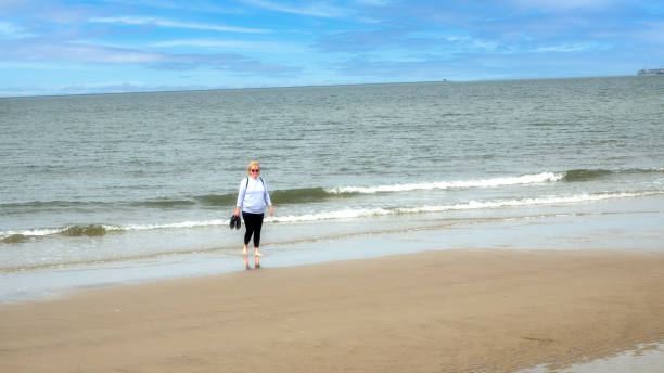 istock walking on the beach in Lewes, Delaware 1320801819
