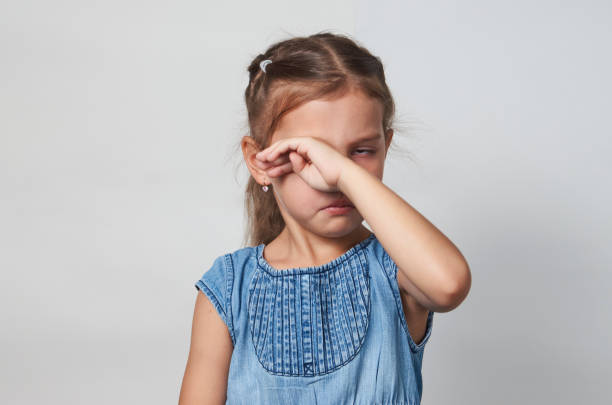istock Sad girl portrait on a white background with copy space 1320802710