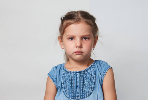 istock Sad girl portrait on a white background with copy space 1320802719