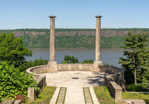 Yonkers, NY - USA - May 27, 2021: A view of Untermyer Garden's Overlook, featuring two ancient Roman monolithic cipollino marble columns which came from the estate of noted architect Stanford White.