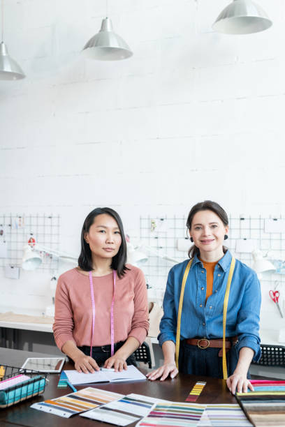 istock Two young successful businesswomen in workshop 1320802956