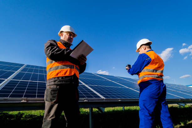istock Inspector examination of photovoltaic modules using a thermal imaging camera 1320807847