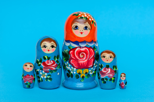 Russian Nesting Dolls also known as Babushkas isolated on white. Shallow DOF.