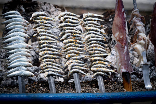 istock grilled sardines and calamari cooked on the beach 1320810463