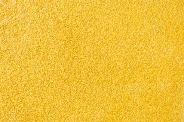 istock Old yellow stone wall background texture sandstone 1320811338