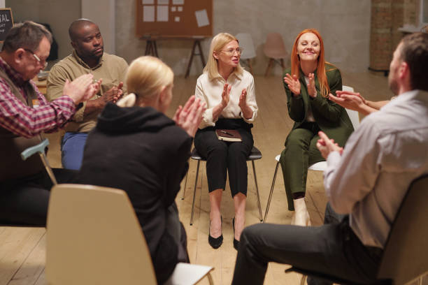istock Happy people clapping hands after hot discussion of psychological problems 1320812933