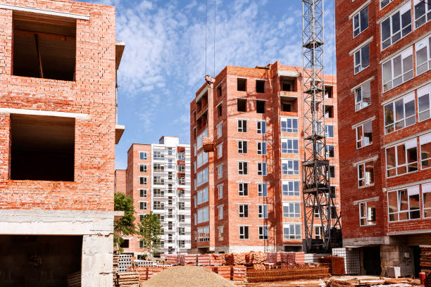 istock Construction site with many brick high-rise buildings 1320814374