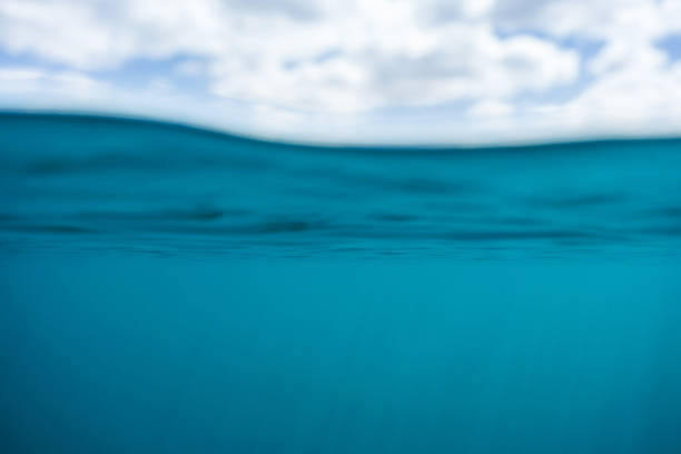 istock Blue water and a cloudy sky above the surface 1320815322