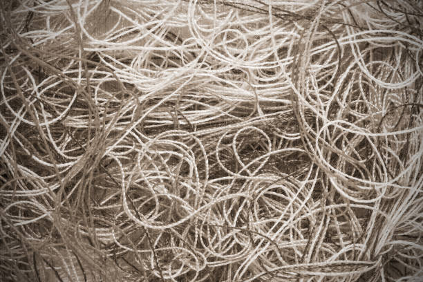 Texture of the filament may serve as a background. Old style. Sepia